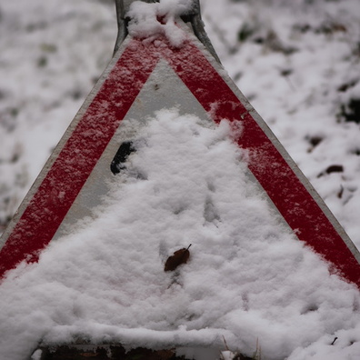 Snow-covered sign