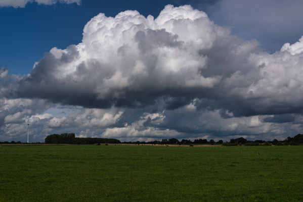 Cumulus cloud formation over rural landscape