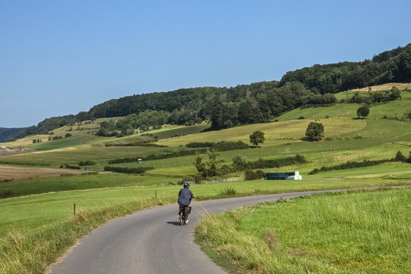 The cyclist and the rolling hills