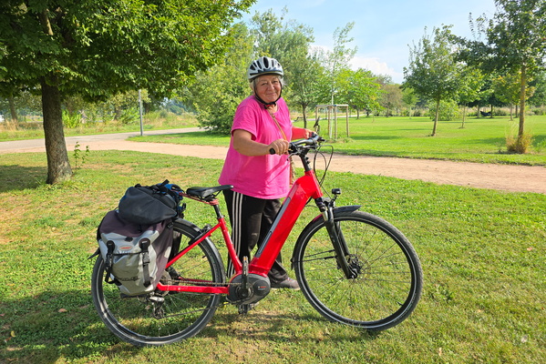 Smiling next to the bike