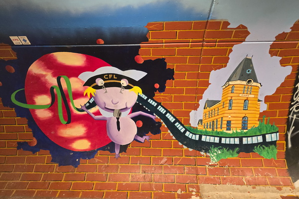 Captain CFL takes a train ride past the Mairie