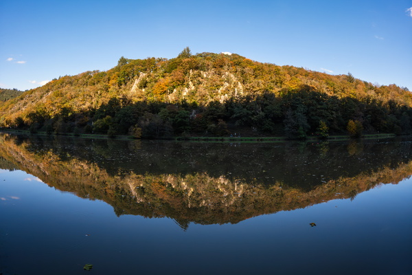 Autumn's embrace in liquid mirror